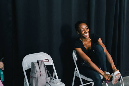 woman sat down smiling